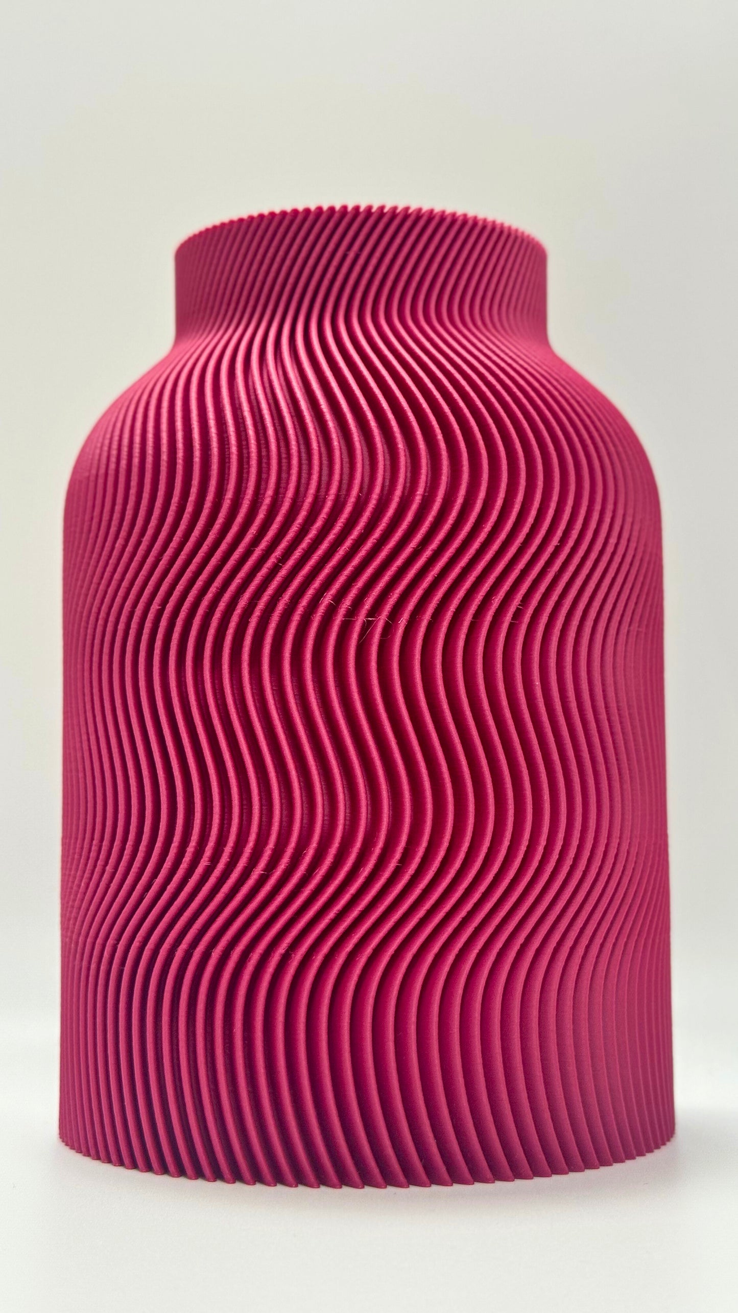Luna Vase in Plum color with modern wavy design and glass insert for flowers