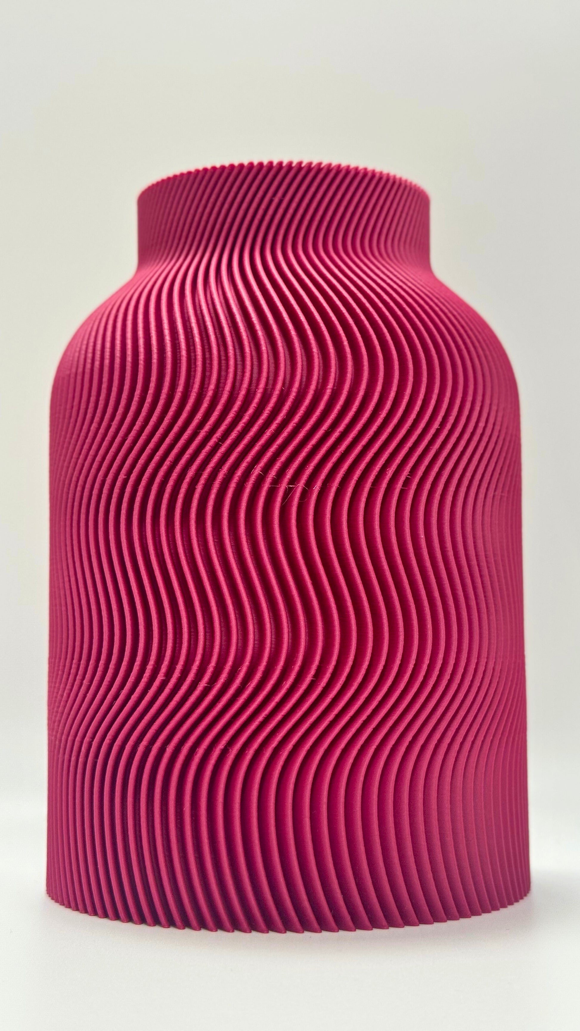 Luna Vase in Plum color with modern wavy design and glass insert for flowers