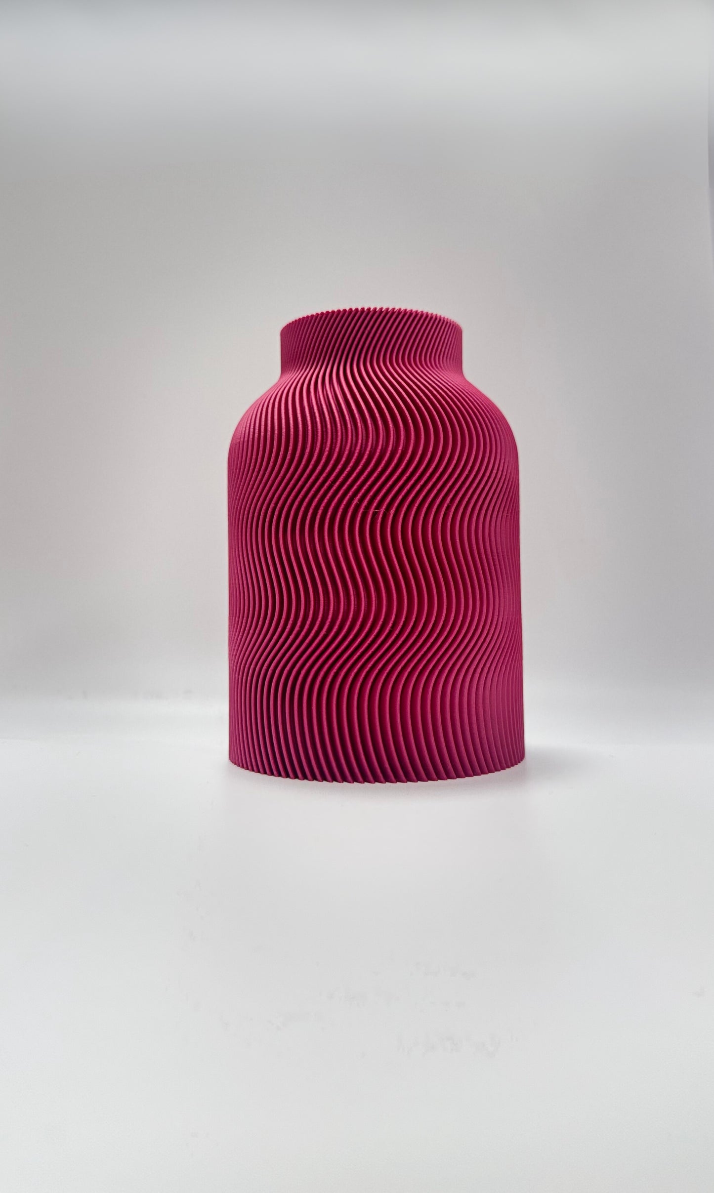 Luna Vase in Plum color with modern wavy design and glass insert for flowers
