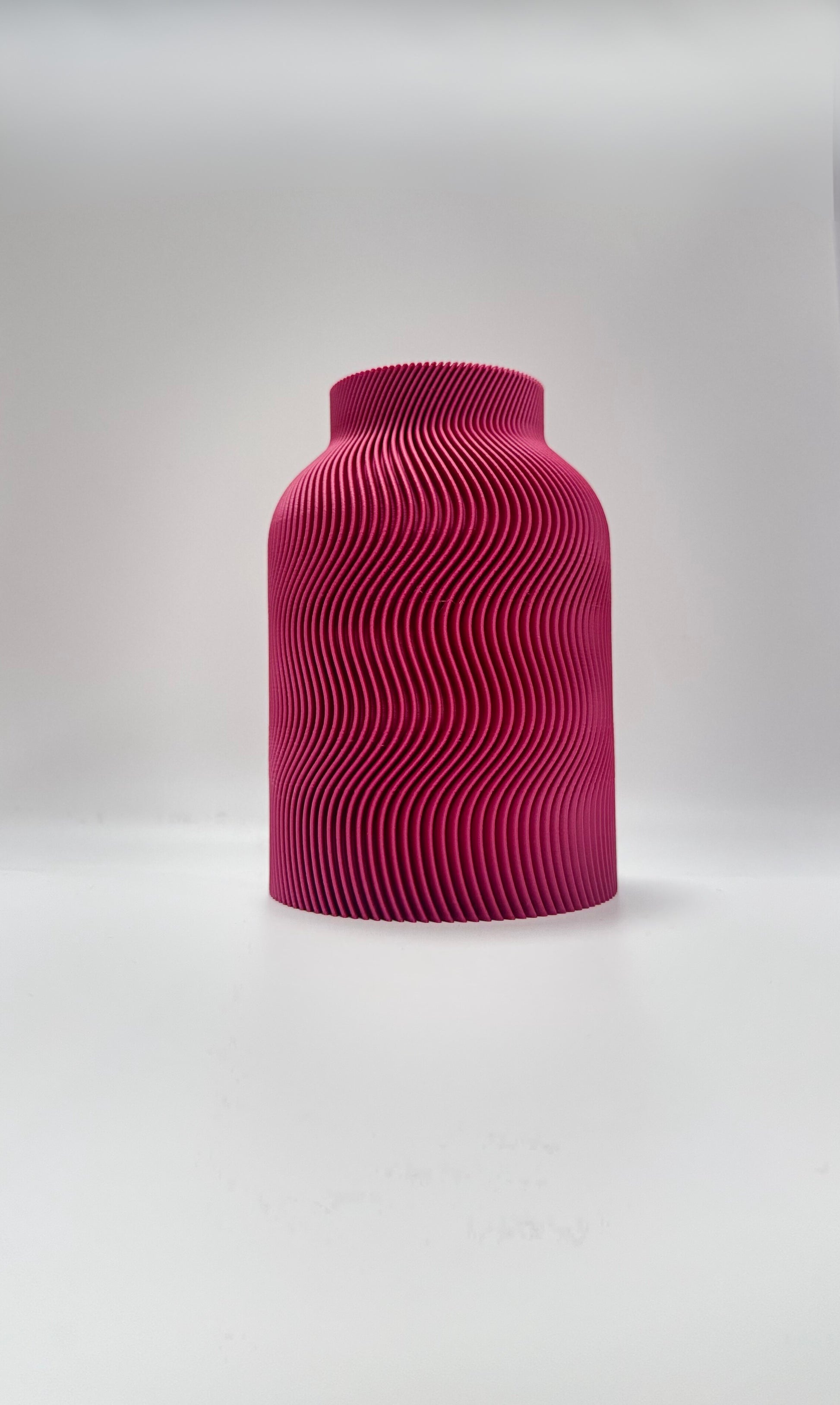 Luna Vase in Plum color with modern wavy design and glass insert for flowers