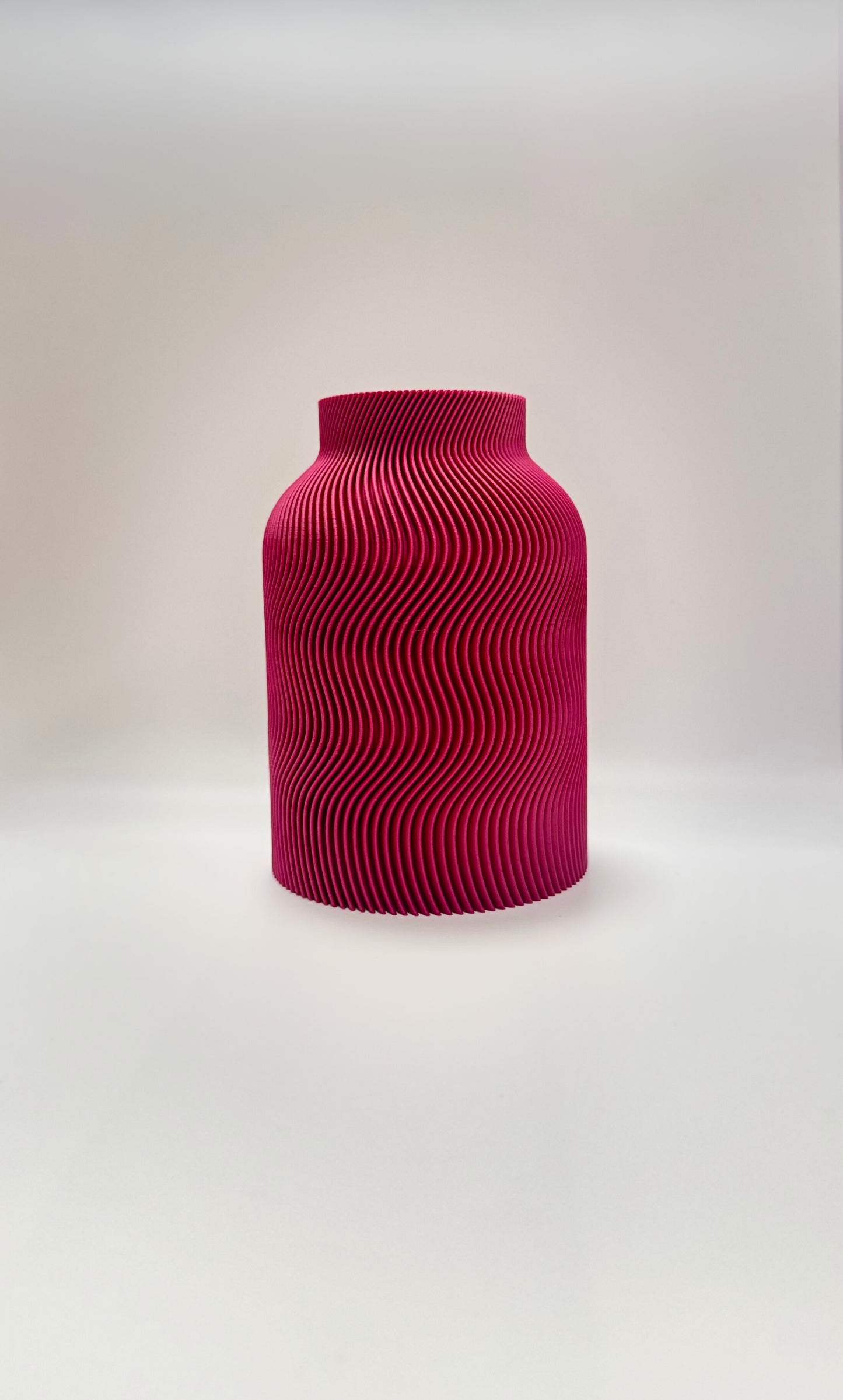 Luna Vase in Plum color with modern wavy design and glass insert for flowers