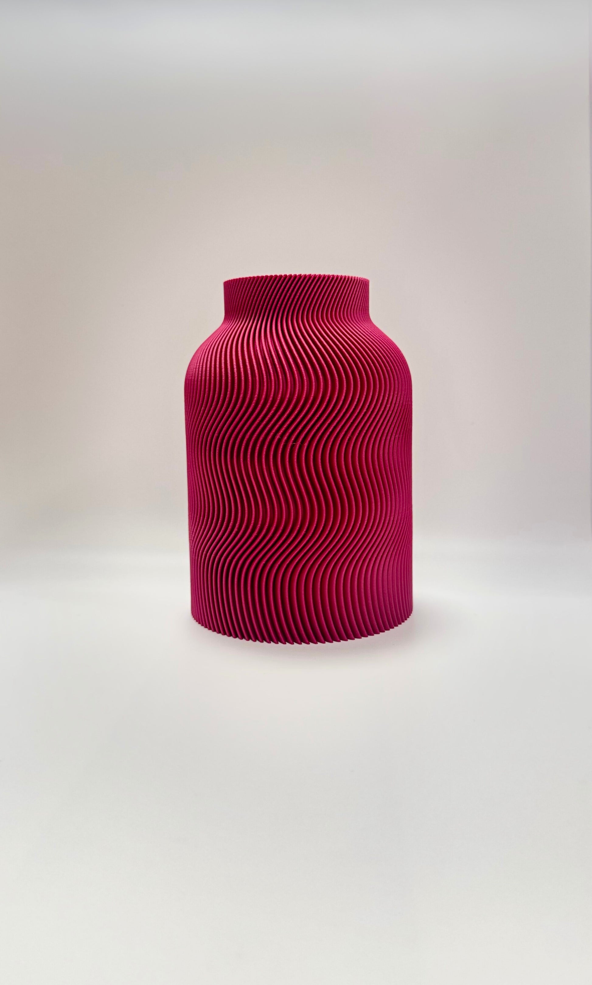 Luna Vase in Plum color with modern wavy design and glass insert for flowers